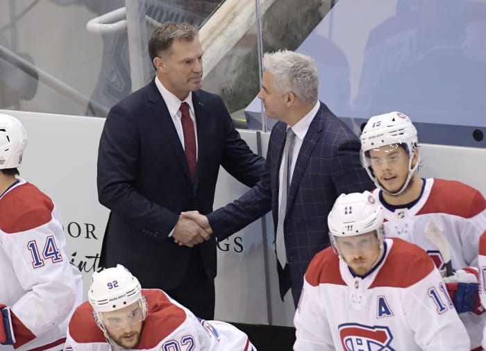 Montreal Canadiens assistant coach Kirk Muller, left took the spot after head coach Claude Julien is out due to health issues for their game against the Philadelphia Flyers in game two of the first round of the NHL playoffs.